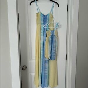 Matching women’s dress is a size S/M 43” long. child’s dress is size 1-2.  16”
